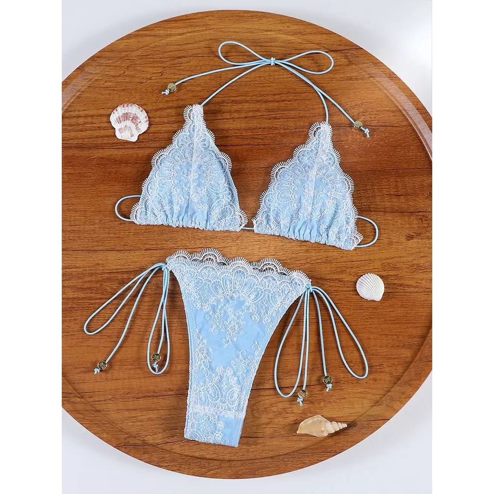 Light blue lace hollow out bandage bikini set with delicate floral patterns and adjustable string ties