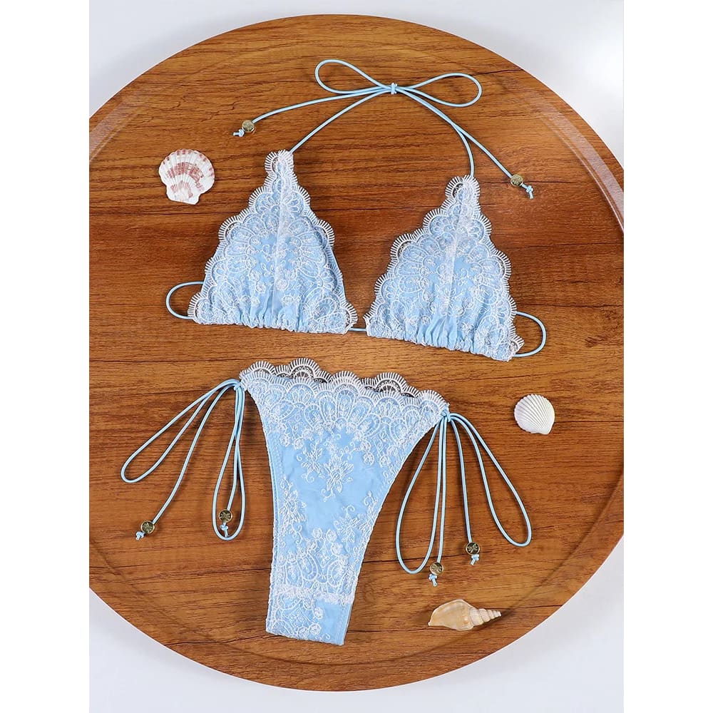 Light blue lace hollow-out bandage bikini set with white floral patterns and adjustable string ties