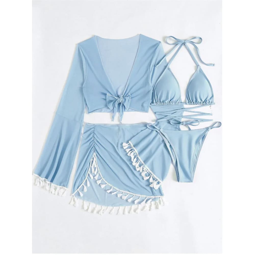 Light blue boho tassel bikini set with matching long-sleeved tassel skirt cover-up for stylish beachwear