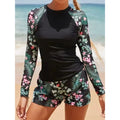 Schwarzes Langarm-Surf-Swim-Set mit grünem Blumenblattprint, Top und Shorts