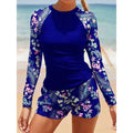 Blauer UV-Surfanzug mit langen Raglanärmeln und tropischem Blumen-Shorts-Set