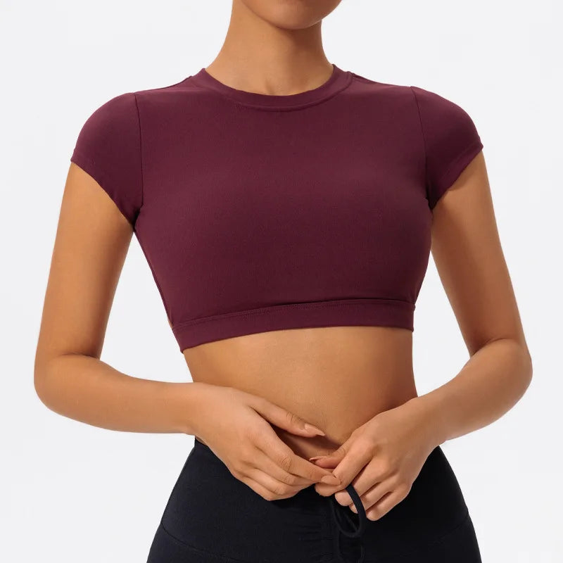 Burgundy sports crop top with crew neckline and cropped hem band