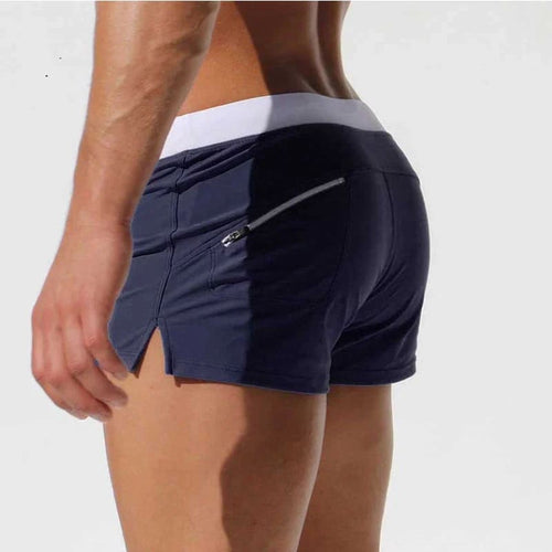 Navy quick-dry swim trunks boxer-brief cut with ruched back and zip pocket detail