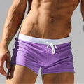 Purple quick-dry swim trunks boxer-brief style with white drawstring waistband