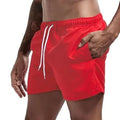 Quick-dry swim shorts, red with white drawstring and elastic waistband