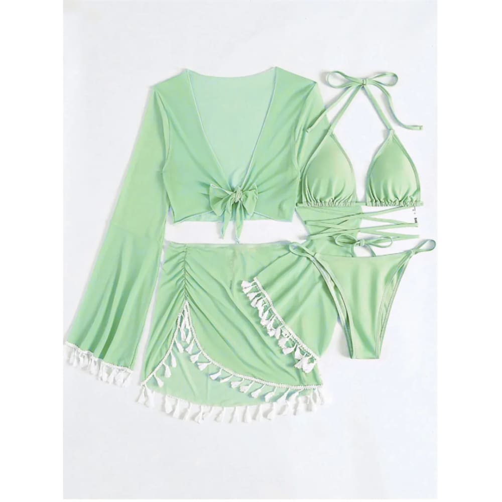 Mint green boho tassel bikini set with white tassel trim tie front details and matching tassel skirt cover up