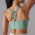 Avocado green yoga tank with built-in bra, crisscross open-back straps