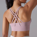 Pinkish purple yoga tank with built-in bra, crisscross open-back straps