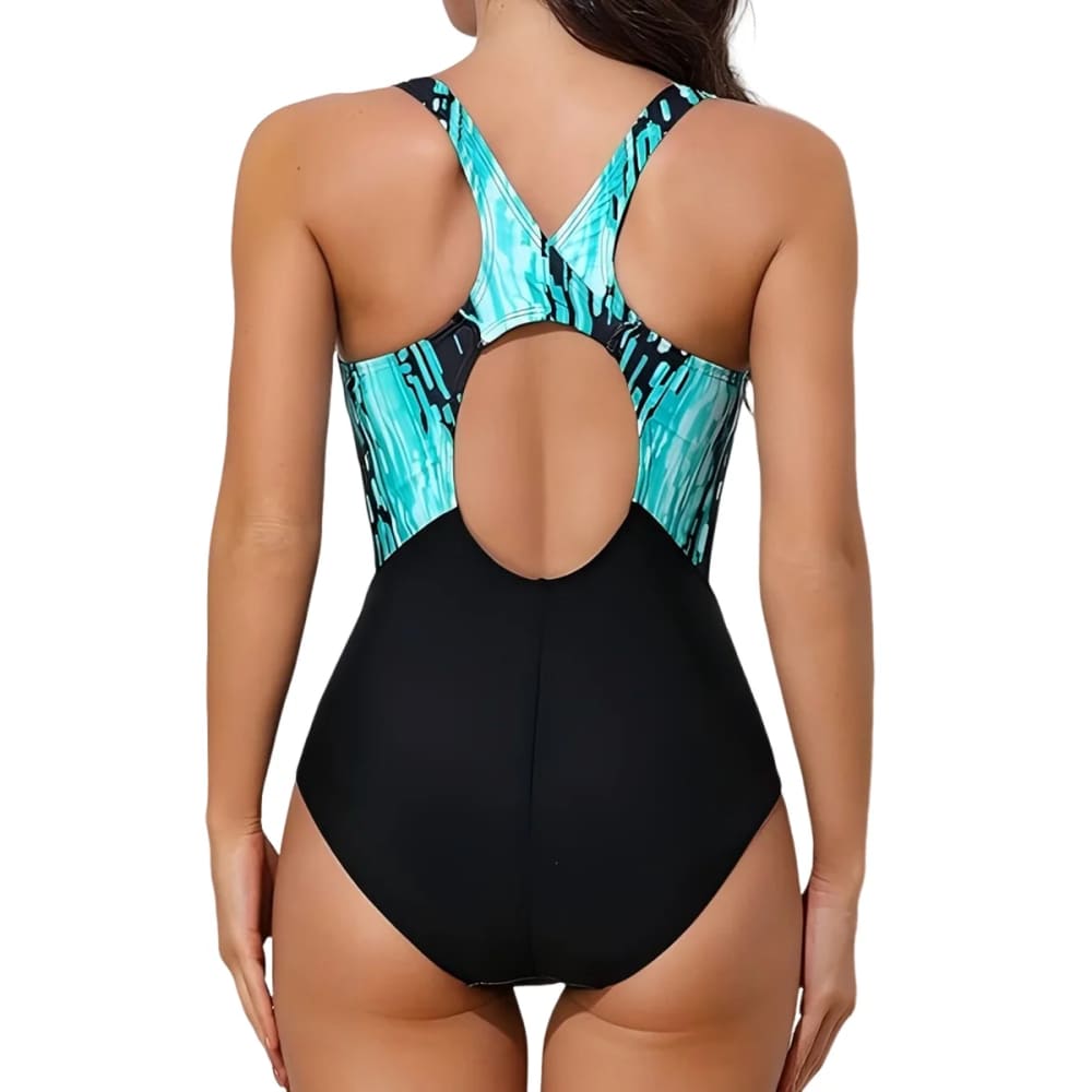Back view of a sporty printed cross-back one-piece swimsuit with black lower section and turquoise abstract pattern top