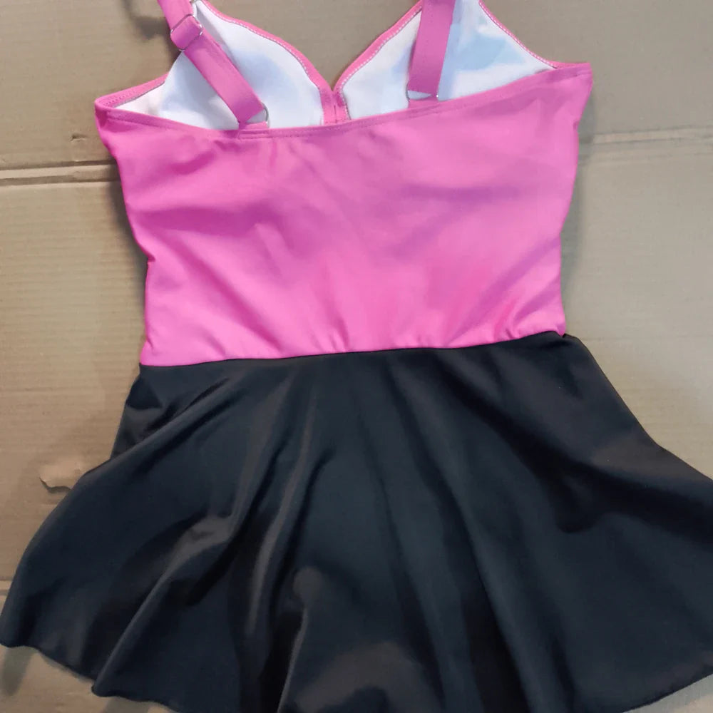 Pink and black two tone tummy control swimdress one-piece with fitted top and flared skirt with adjustable straps
