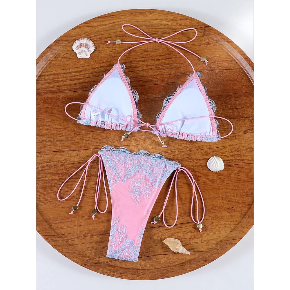 Pink and light blue lace hollow‑out bandage bikini set with delicate ruffled edges and adjustable metallic bead ties