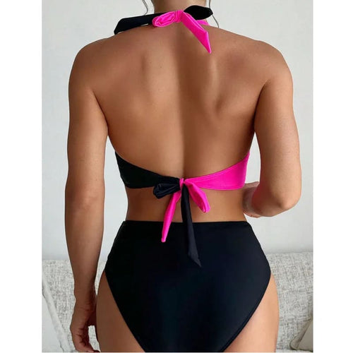 Two-tone Brazilian bikini set, back view: hot pink and black top with tied back, briefs