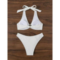 White bikini set flat lay: bow halter triangle top and high-cut matching bottoms