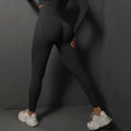 Black high-waist yoga leggings with booty-contour seams, full-length