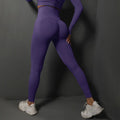 Purple high-waist yoga leggings with booty-contour seams, full-length fit
