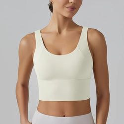 Light ivory shockproof yoga bra with scoop neckline and smooth supportive band