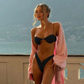 Black micro bikini set with bandeau top and low-waist bottoms, ring detail