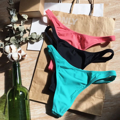 Thong bikini bottoms in pink, black, and turquoise—mix set of T-back styles