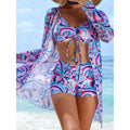 A vibrant flowy beach cover-up with a tie-dye swirl pattern in pink blue and white for the tie-dye bikini set