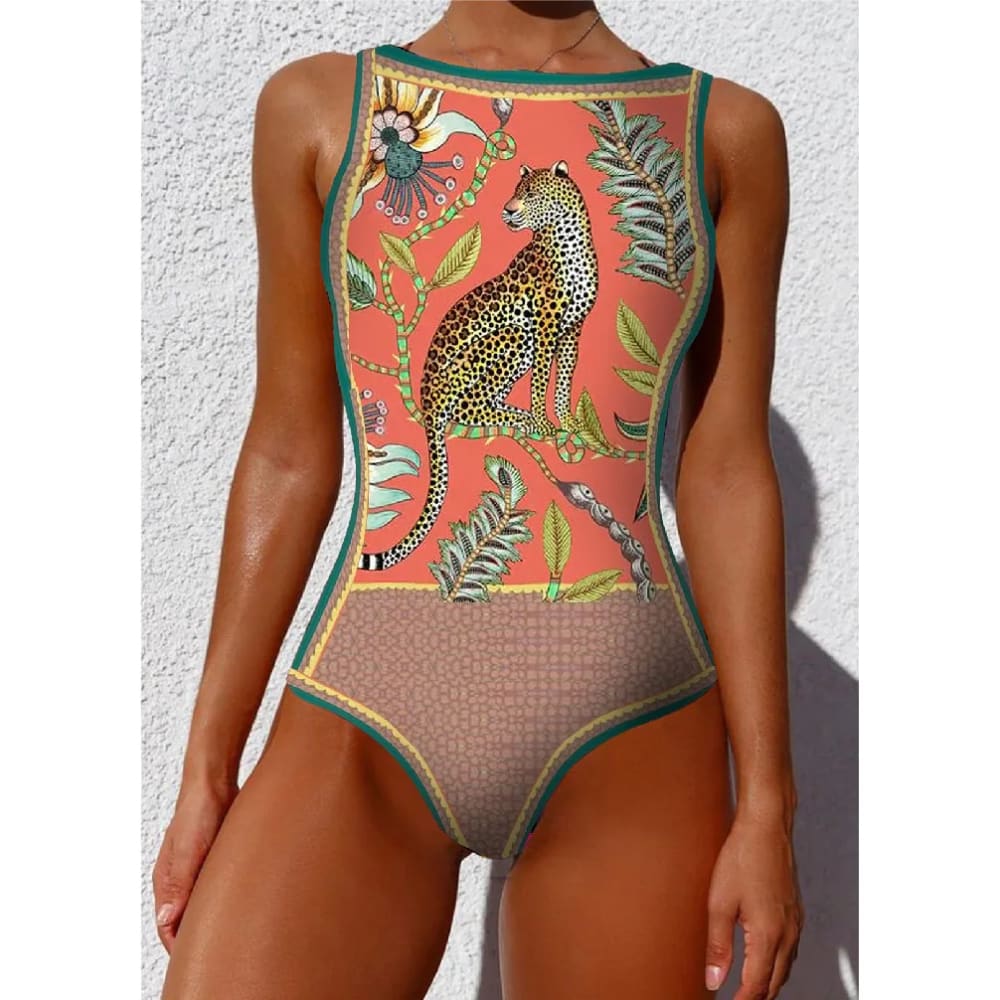 A vibrant coral ethnic floral animal one-piece swimsuit with leopard botanical print and green trim
