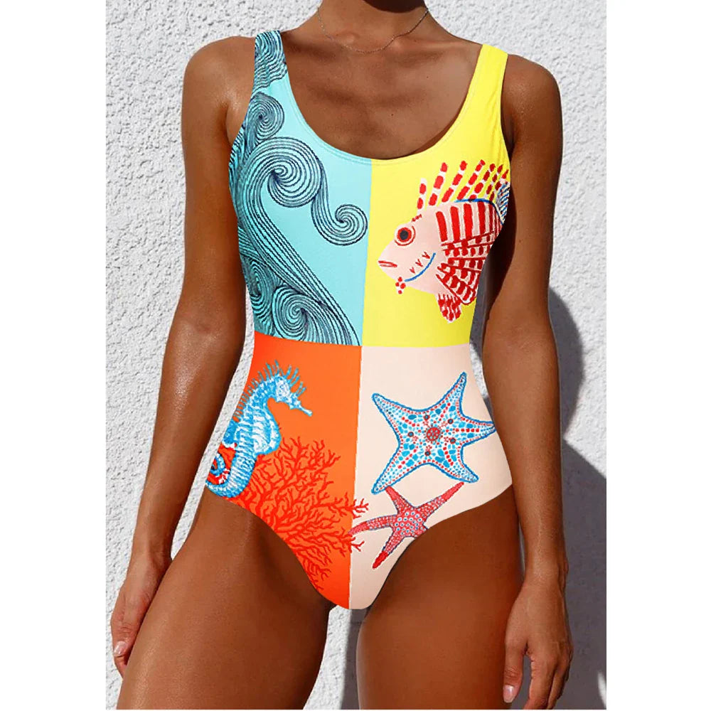 Vibrant ethnic floral animal patchwork one-piece swimsuit with colorful marine life motifs on yellow teal orange panels