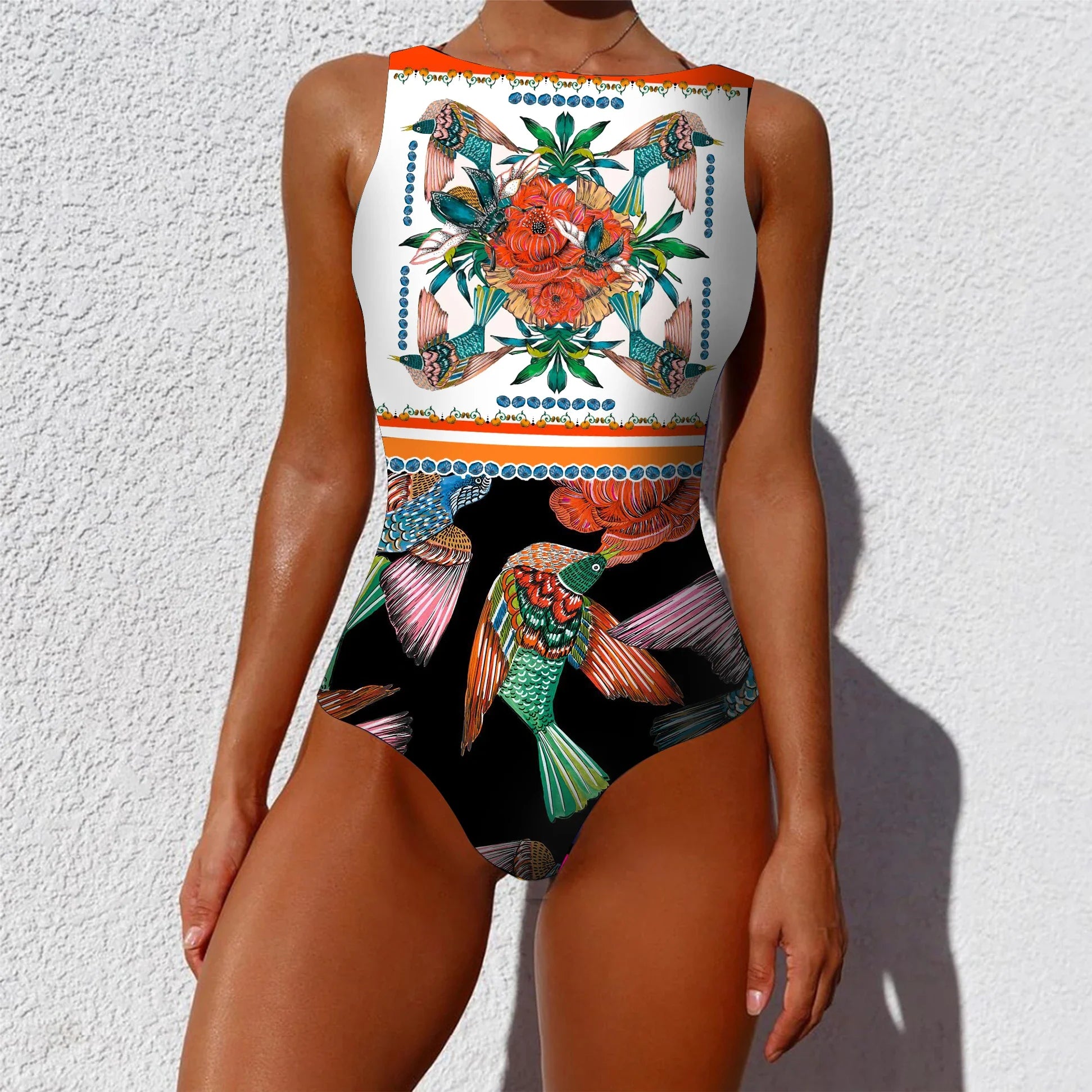 Ethnic floral animal patchwork one-piece swimsuit with bold tropical bird and floral pattern in orange teal pink and green