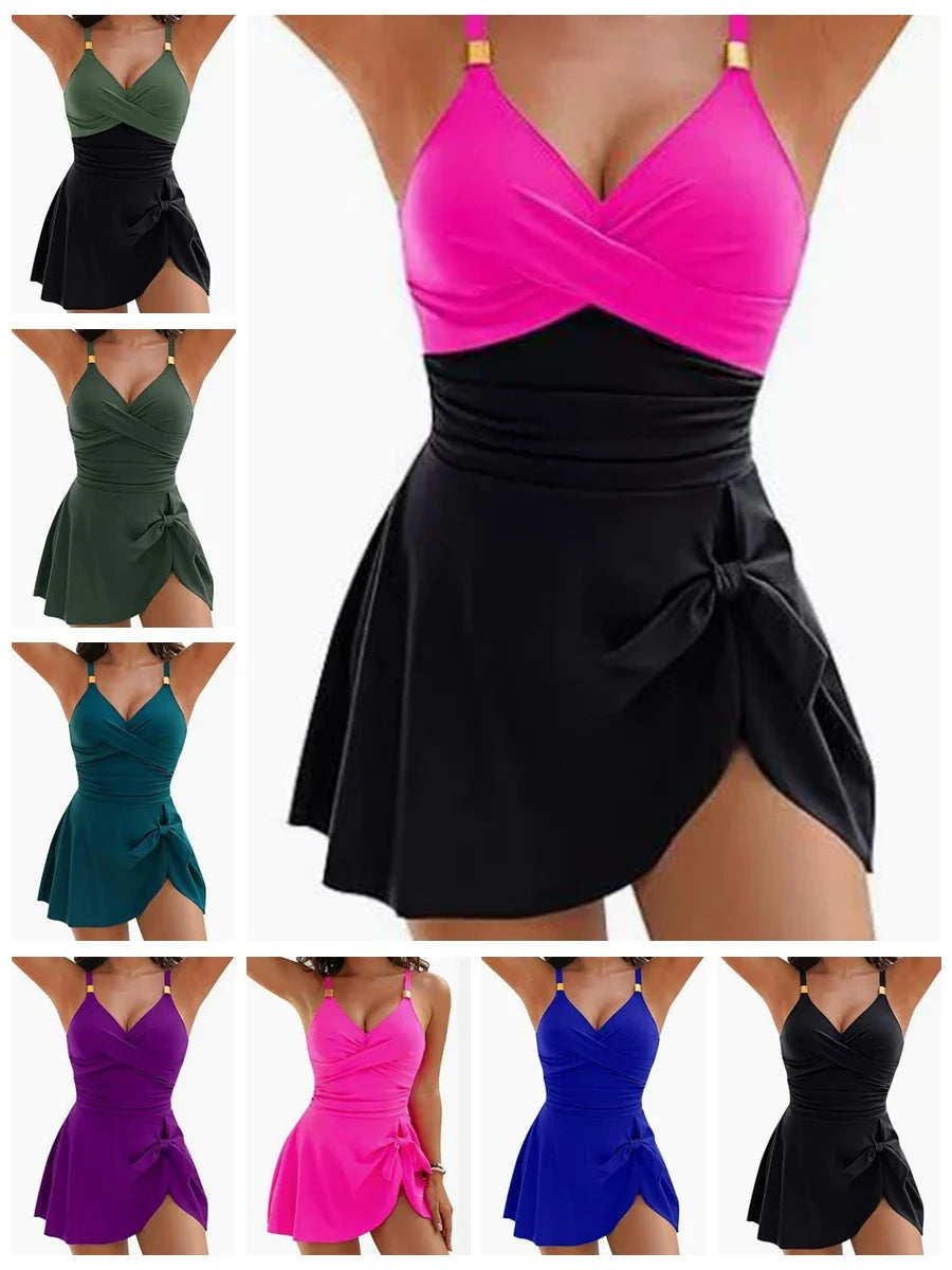 Vibrant pink and black tummy control swimdress one-piece with adjustable straps and draped wrap-style skirt