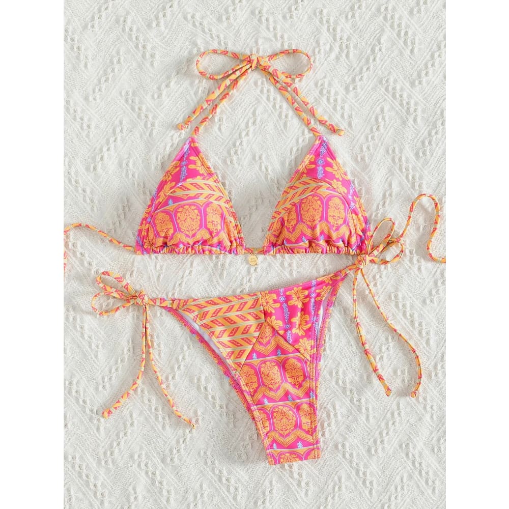 Vibrant pink and orange floral push up triangle bikini set with skull motifs and brazilian bottoms