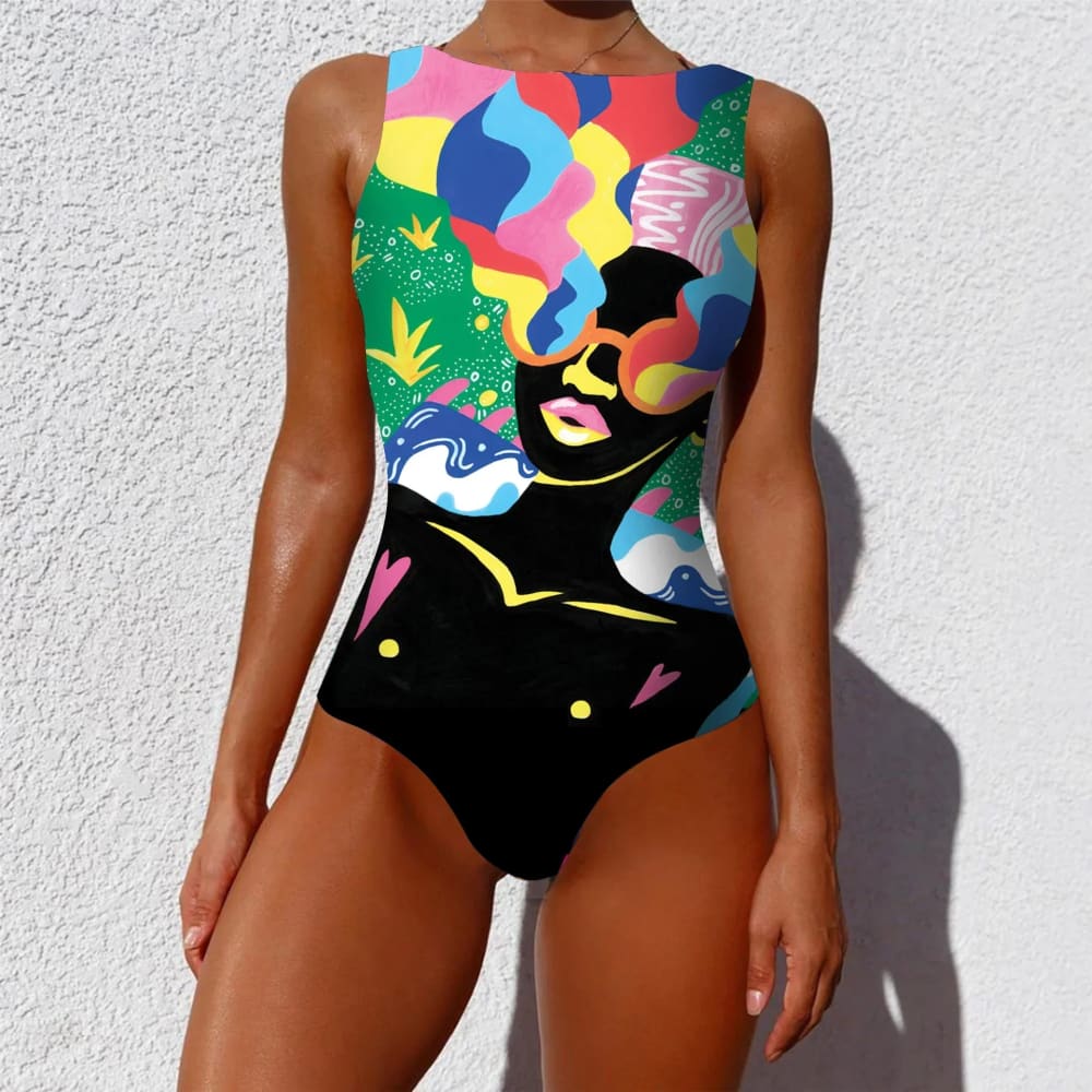 Ethnic floral animal sleeveless one-piece swimsuit with bold black silhouette and colorful pink blue yellow green patterns
