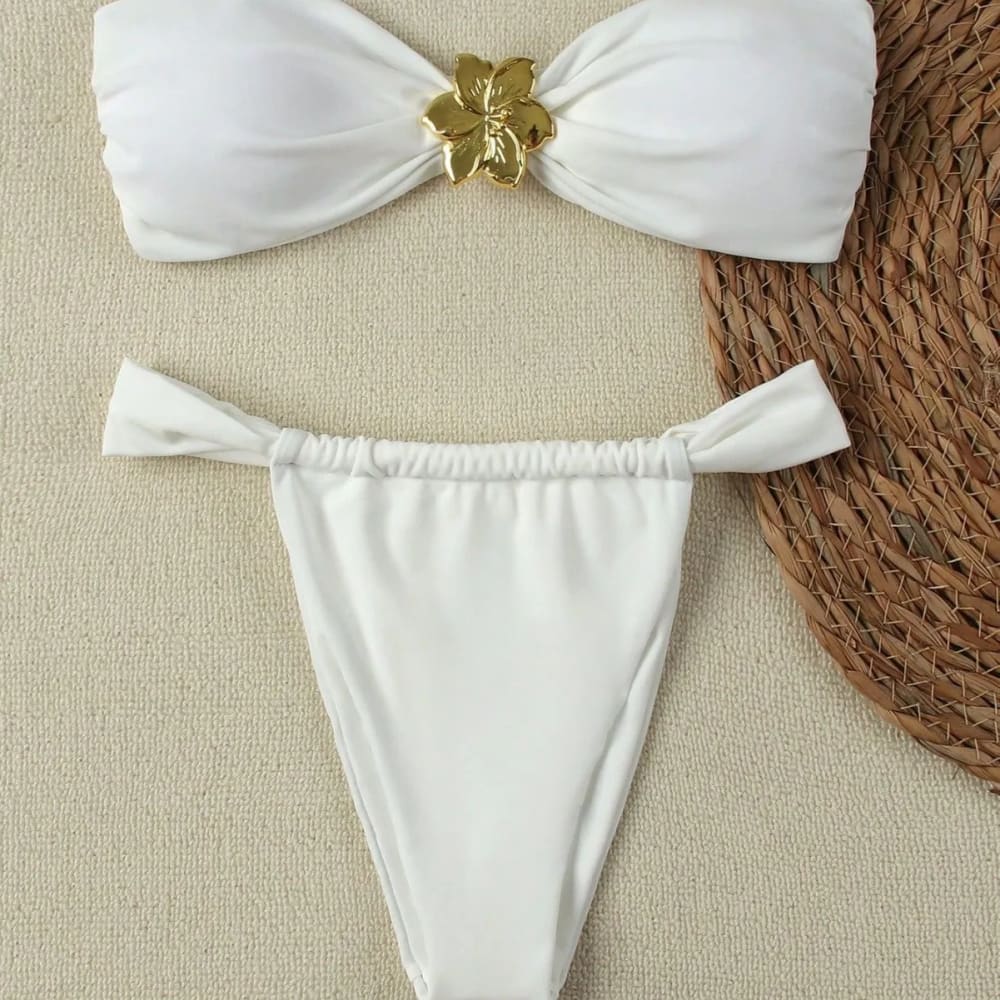 White bandeau push-up bikini set with gold floral clasp and matching brazilian thong bottoms with side ties