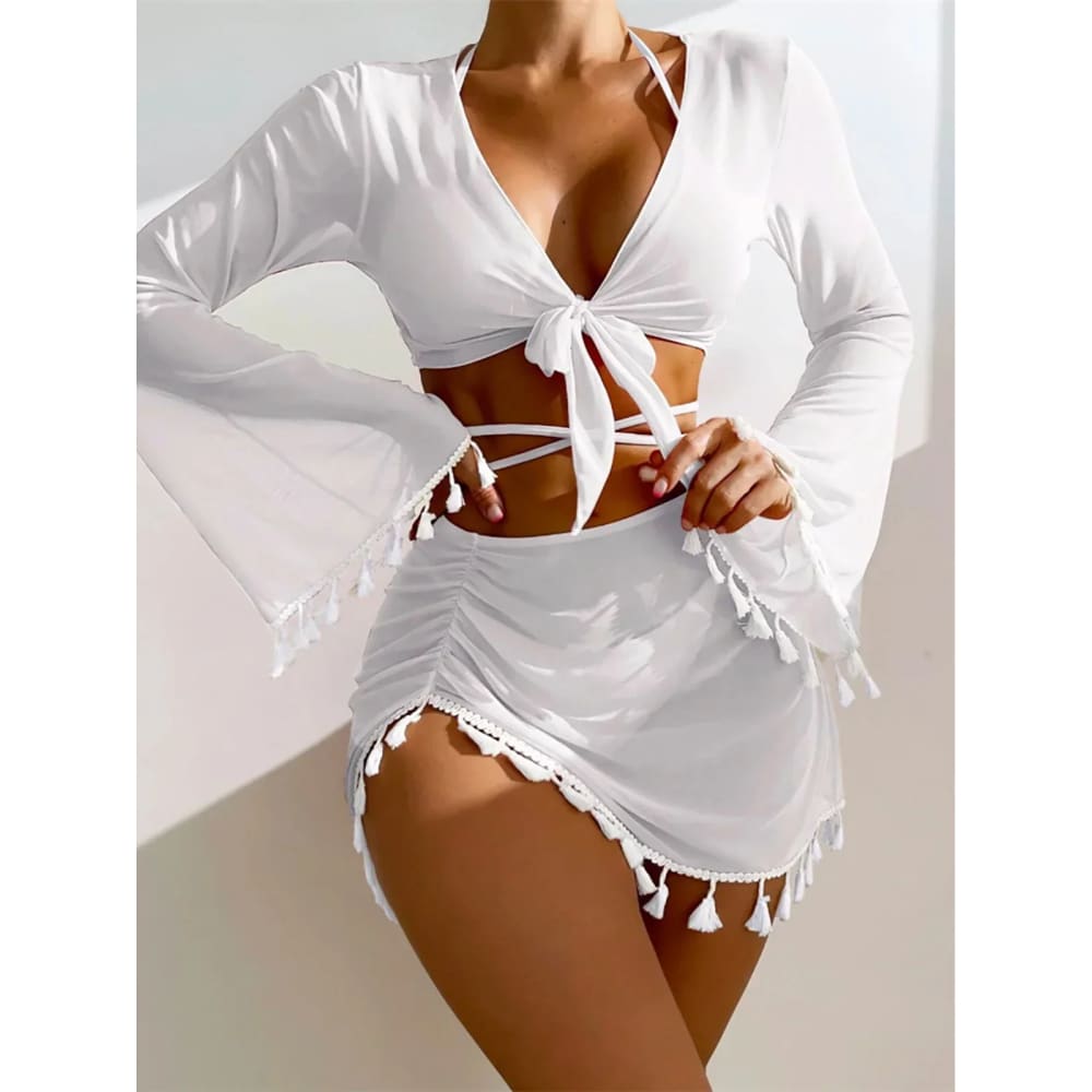 White long-sleeved bell-shaped top with deep v-neck and front tie detail in boho tassel bikini set cover-up