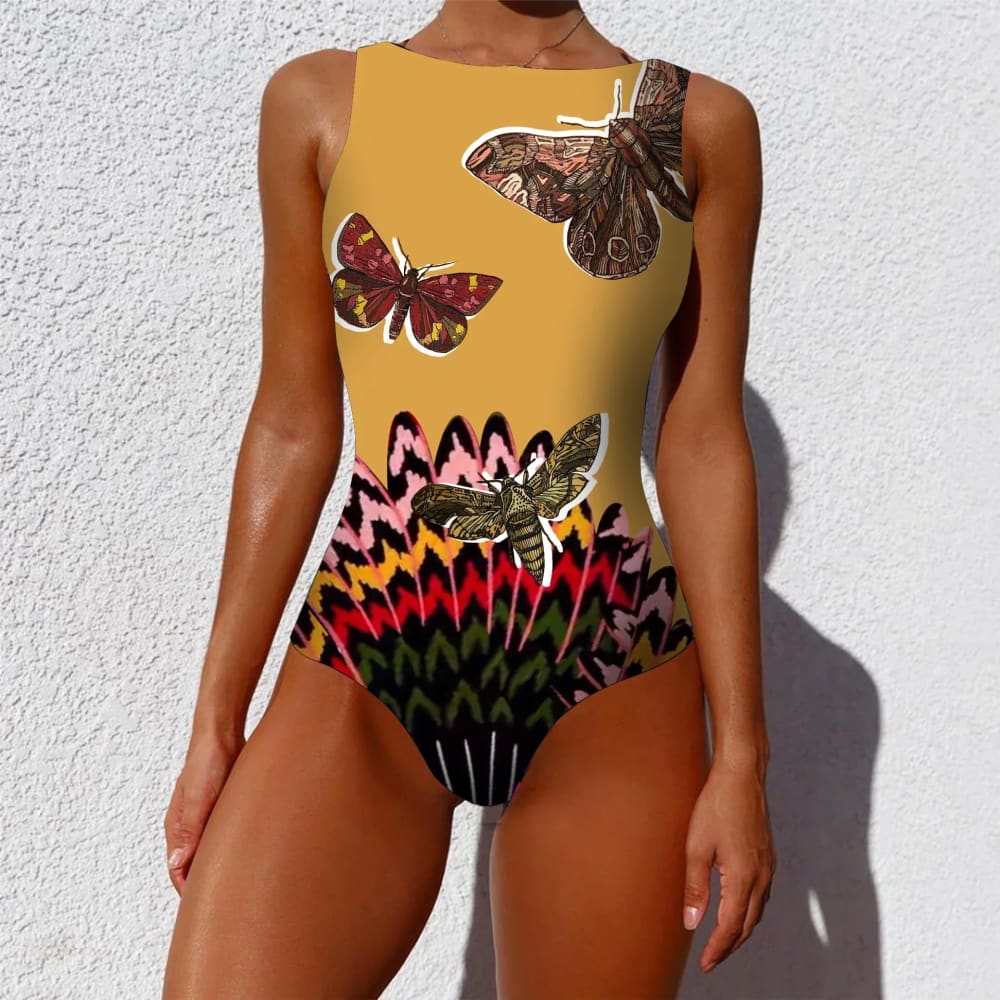 Yellow ethnic floral animal one-piece swimsuit with vibrant butterfly and zigzag pattern in brown pink red green and black