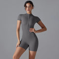 Dark grey yoga jumpsuit with front zipper and short sleeves, fitted short legs