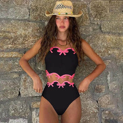 Black bikini set with pink bow trim, scalloped high-waist Brazilian bottom and crop top