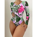 Tropical print long-sleeve one-piece with pink, green, and purple leaves; high-cut backless