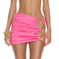 Pink ruched high-waist mini skirt with cutout sides and gold flower accents