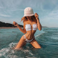 White ruched bandeau bikini set with matching tie-string Brazilian thong