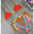 Red triangle bikini set with gold trim and patterned high-waist strappy bottoms